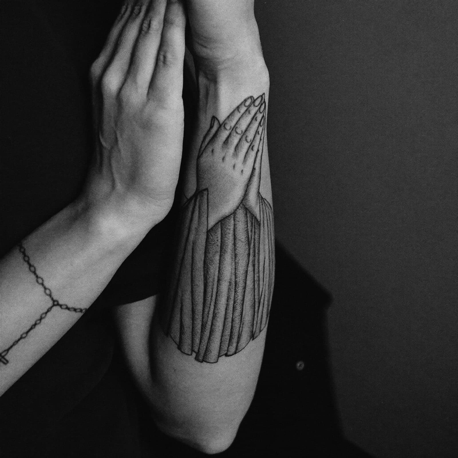 Religious scene on the forearm