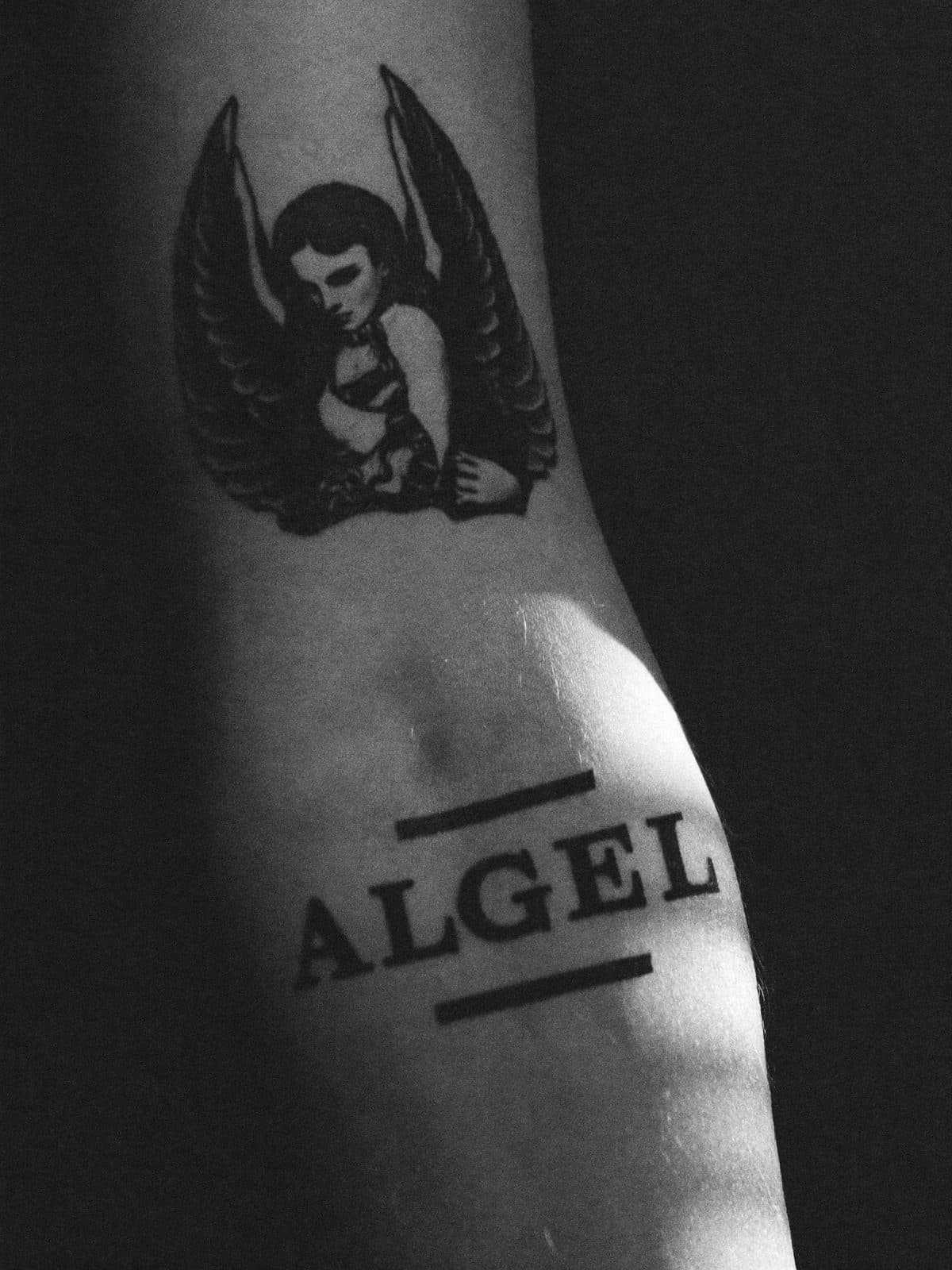 Angel with script, inner forearm