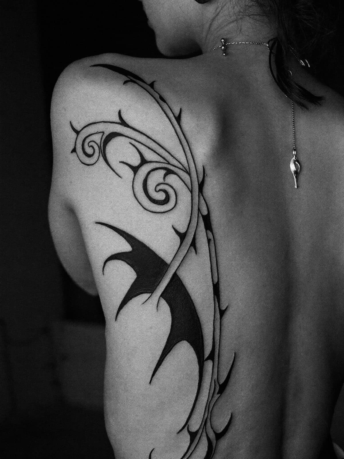 Ornamental blackwork across the shoulder